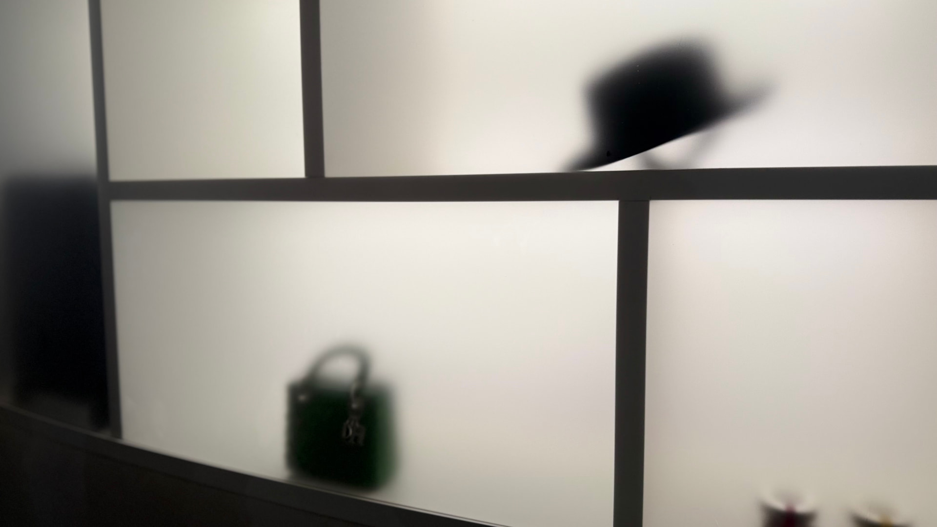 Minimal gallery interior with framed panels and soft light